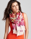 Gorgeous patterns of birds of paradise embellish an oblong wool scarf from Inoui.