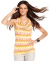 A petite cowlneck top from INC hides a surprise: a sexy cutout in the back! Zigzag-burnout printed fabric gives it pop!