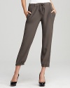 A slim, fluid silhouette and updated cargo details lend a sophisticated air to these Eileen Fisher silk cropped pants.