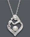 There's nothing like a mother's embrace. This symbolic pendant features a mother and child in a loving heart shape. Necklace combines polished sterling silver, a cultured freshwater pearl (5 mm), and sparkling diamond accents. Approximate length: 18 inches. Approximate drop: 3/4 inch.