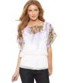A soft floral print drapes down the front of this AGB top. Chiffon and the peplum hem add to the feminine feel!