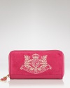 Practical style gets a hit of cool with this velour wallet from Juicy Couture. With plenty of pockets to keep cash, cards and coins, it's ready for your daytime sprees.