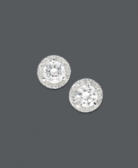 Traditional diamond earrings with an extra touch of sparkle. Round-cut diamonds are encircled by a halo of round-cut diamonds (1 ct. t.w.). Set in 14k white gold. Approximate diameter: 5 mm.