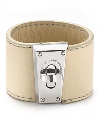 Pop and turnlock it with this tough-chic leather bracelet from MARC BY MARC JACOBS. The bold brass hardware lends this chunky showpiece serious edge.