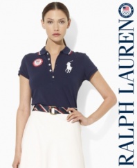 An iconic polo shirt from Ralph Lauren is crafted in a slim stretch silhouette from breathable cotton mesh and accented with bold country embroidery to celebrate Team USA's participation in the 2012 Olympic Games.