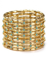 Nail this season's eclectic jewelry trend with coil bracelet from Cara. Decorated with layers of gold stones, this bohemian piece will work just as well for day as for night.