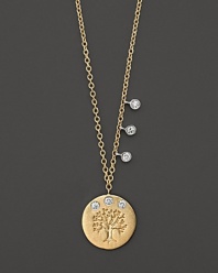 An embossed tree and three glittering diamonds grow on a matte gold disc.