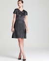 A little rock and roll, a little retro chic, this DKNY dress presents a polished punk that is devastatingly cool.