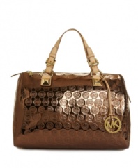 With a mirror-like metallic body embellished with monogram logos, the Jet Set Grayson barrel purse by MICHAEL Michael Kors adds a high-drama element to your look.