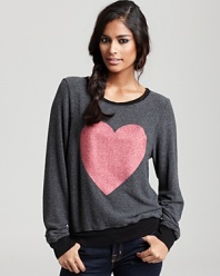 Fall in love with this slouchy-chic WILDFOX sweatshirt, featuring a sparkling glitter heart.