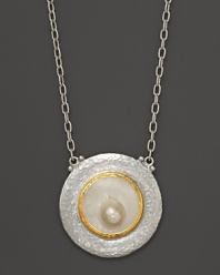 A Mabe pearl gleams at the center of this artful pendant necklace in sterling silver with 24K yellow gold accents. From Gurhan.