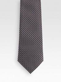 Patterned tie woven in fine Italian silk.About 3.1 wideSilkDry cleanMade in Italy