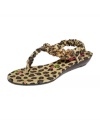 Leopard love. Make a bold statement with the golden chains and dramatic animal print of the Kinkkii P flat sandals by Betsey Johnson.
