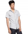 How the west was hip. This snap-front shirt from Kenneth Cole Reaction brings cowboy style to your casual look.