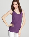 Add a pop of color to your working wardrobe with this slouchy Eileen Fisher tank. A bold grape hue adorns a longer silhouette for a peppy version of the closet staple.