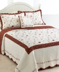 Whimsical florals in delicate embroidery cascade across crisp cotton quilting in this Silkroad sham. The reverse presents a rich pattern of taupe florals over burgundy ground, offering a warm color accent.