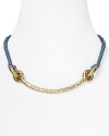 Mixed materials make a strong statement on this collar necklace from Giles & Brother. It's braided leather lends an artisan edge, while a pair of gleaming knots make a subtle nod to nautical style.
