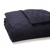 A classic check pattern in cotton jacquard infuses this luxe HUGO BOSS duvet cover with textural richness. The dramatic navy hue dazzles against white sheets and accent pillows.