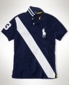 A regal-looking athletic favorite, this custom-fit polo is crafted in a breathable cotton mesh and accented with a dynamic sash across the front.