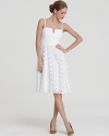 Fashioned in delicate eyelet, this gorgeously tailored Milly dress exudes ladylike charm.
