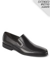 Rounded toe slip-on shoes with top stitch detailing along the toe and elastic inserts for easy slip on and off. Durable rubber sole.
