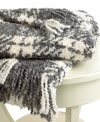 Beat the cold with this super-soft throw from Lauren by Ralph Lauren. Features a boucle plaid knit in gray and cream hues for a cozy addition anywhere in your home. Finished with a 3 fringe.