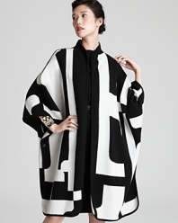 Be bold in this geometric knit Escada cape--the ultimate winter-wardrobe wow piece.