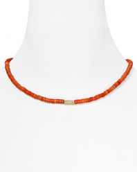 Basic yet bold. Let MICHAEL Michael Kors lend every look a colorful touch with this simple strand of coral beads, accented by a gold plated metal bar.