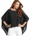 Total drama! Voluminous poncho sleeves spread like wings on this swoon-worthy top from Jessica Simpson. Pair the piece with white-wash skinny jeans for casual style that goes big!