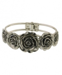 Highlight your unique sense of style in beautiful blossoms. 2028's fresh floral cuff features intricate flowers with jet enamel accents. Crafted in silver tone mixed metal. Approximate diameter: 2-1/5 inches.