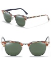 Rimless wayfarer sunglasses with camouflage accents for a tough girl style.
