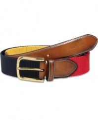 This pieced web belt with tapered leather tab and tip from Tommy Hilfiger is the perfect piece to hold up your prep style game.