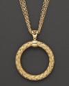 Multiple chains flank an intricately woven yellow silver pendant from Fifth Season by Roberto Coin.