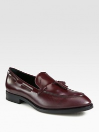 Front tassels and kiltie trim add moccasin inspiration to these glossy, Italian leather loafers. Leather upperLeather liningPadded insoleRubber soleMade in Italy