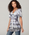 A seductively twisted front and lovely lace trim create a feminine look on One World's tunic top!