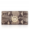 Sophisticated yet sultry, this sleek snakeskin print wallet by Michael Kors will make them stop and stare. Accented with polished signature hardware, this flawless wallet is the epitome of timeless chic.