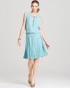 With a romantic Grecian silhouette thats perfect for day or night, the BCBGMAXAZRIA Lona dress features a billowy top and a fluid pleated full skirt in a cool sea blue hue.