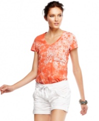 An allover tie-dye print with scrolling details at the shoulder lend a world-traveled look to this Calvin Klein Jeans top.