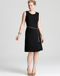 A metallic belt electrifies a black Calvin Klein Plus dress, touting a fit-and-flare silhouette for a modern feminine statement. Keep the style strong with sleek accents.