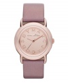 Tastefully trendy. The perfect amount of pink shimmer warms up this watch by Marc by Marc Jacobs. Metallic blush leather strap and round rose-gold ion-plated stainless steel case. Rose-gold tone mirrored dial features rose-gold tone logo letters at markers and three hands. Quartz movement. Water resistant to 50 meters. Two-year limited warranty.