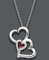 Say it from the heart. Treasured Hearts' stunning pendant features three, open-cut hearts in sterling silver. Center heart features a red enamel center surrounded by sparkling, round-cut diamonds (1/10 ct. t.w.). Approximate length: 18 inches. Approximate drop: 1 inch.