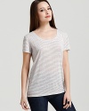 Styled on its own or slipped under a cardigan, this Eileen Fisher tee is a must-have staple for the season. Highlight the understated stripes against white denim for crisp summer style.