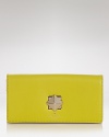 kate spade new york's ever-chic wallet gets prettier in luxurious leather with a bold turnlock closure. Equal parts practical and playful, it's perfect companion for purse or palm.