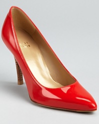 In slick patent leather, these Stuart Weitzman pumps breathe color into practicality.