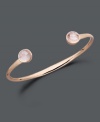 Add a girly touch with this ultimately feminine design. Studio Silver's blush tones bangle highlights round-cut rose quartz ends (4 ct. t.w.) set in 18k rose gold over sterling silver. Bracelet slips easily over the wrist. Approximate diameter: 2-1/2 inches.