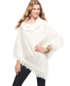 American Rag's poncho is trend-forward with statement-making fringe! Cuddle up in fashionable warmth.