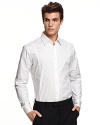 Slim fit, long sleeve shirt with spread collar. Button front with barrel cuffs. Clean front, no pockets. Rounded hem.