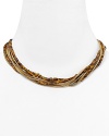 Follow your feline instincts and flaunt MICHAEL Michael Kors' tiger's eye torsade necklace--the captivating collar lend exotic flair to staple tees or femme blouses.
