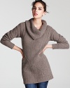 A chunky ribbed cowlneck and cable knit detail lend luxe to this chic sweater from C by Bloomingdale's.