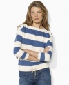 Infused with nautical inspiration, Lauren Jeans Co.'s essential French terry pullover features bold stripes, three-quarter sleeves and anchor-embossed buttons for seaworthy style.